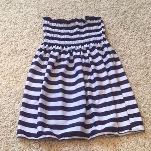 Woman’s striped strapless dress